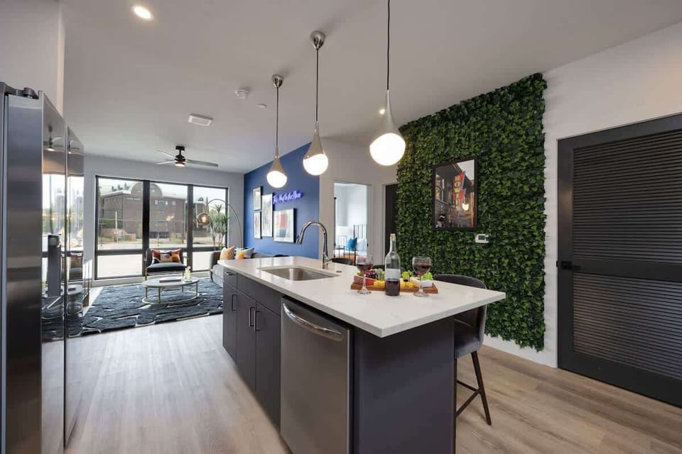 Fully equipped kitchen stocked with your basic cooking essentials. Includes stainless steel appliances and small kitchen island with bar seating.