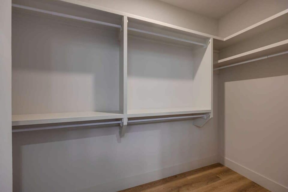 Primary bedroom large walk-in closet.
