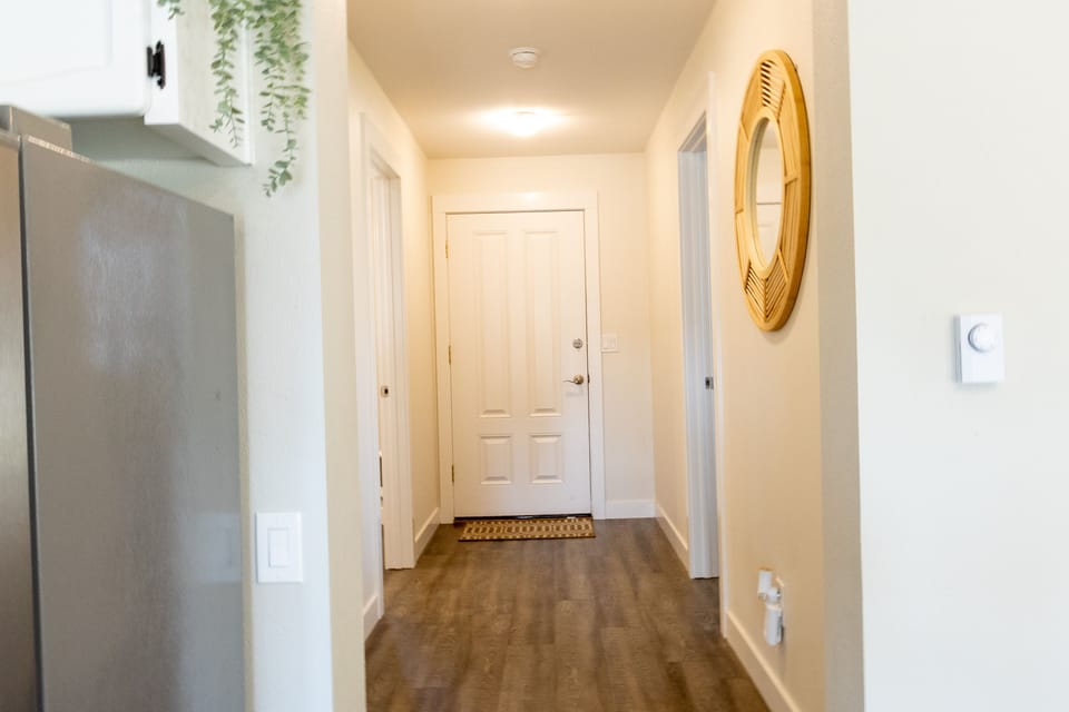 Hallway Leading to Backyard, Bedroom and Bathroom