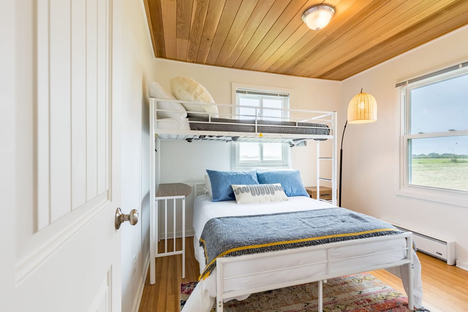 Bedroom 2 features a lofted twin bed and a full bed.