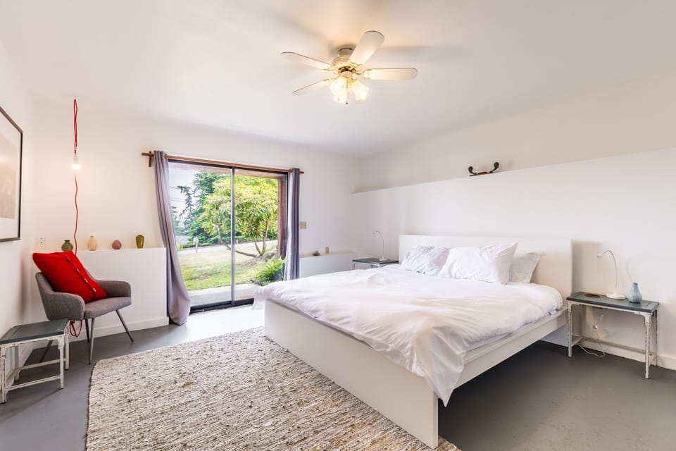 Primary bedroom features a king bed and outdoor access.