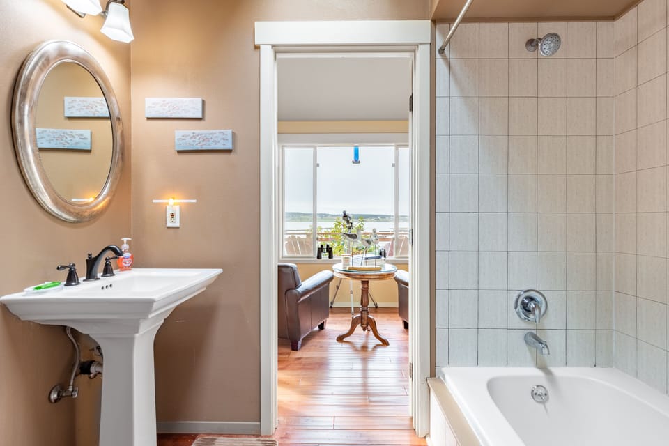 Bathroom 1 features a shower/tub combo.