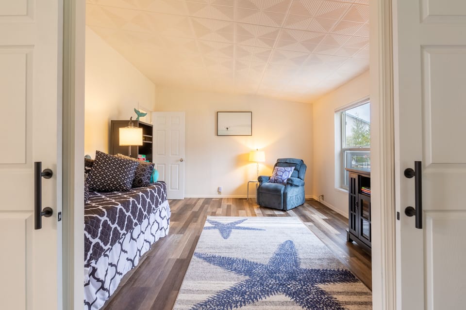 Trundle daybed in the sitting room sleeps an additional 2 people and can be closed off for privacy.