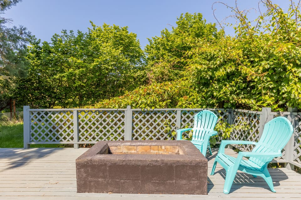 Gather around the fire pit located on the deck.