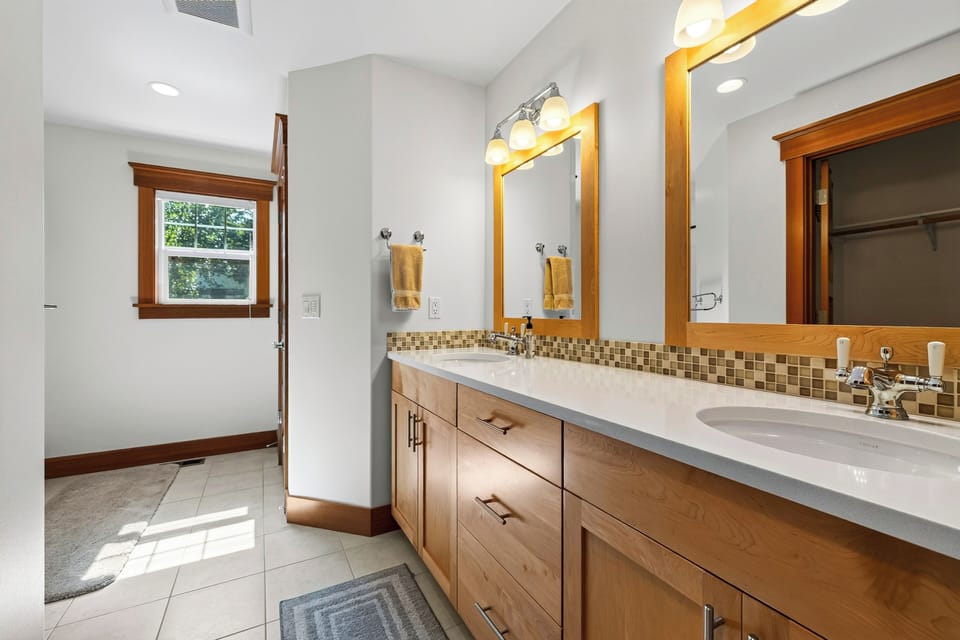 Primary bedroom's ensuite features a shower and a tub.