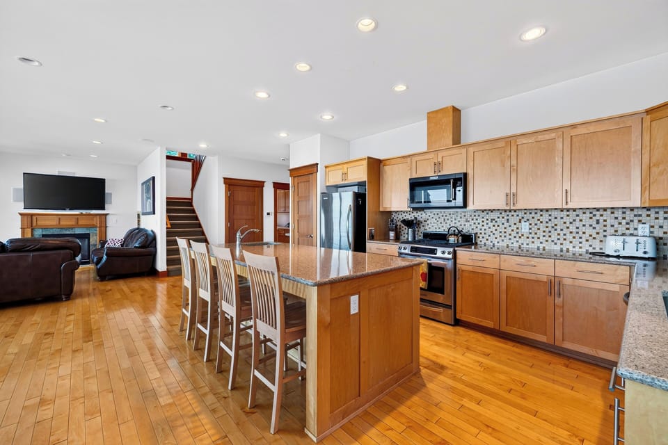 Pull up a seat at the expansive kitchen island, with plenty of room for meal prep, breakfast, and casual conversation.