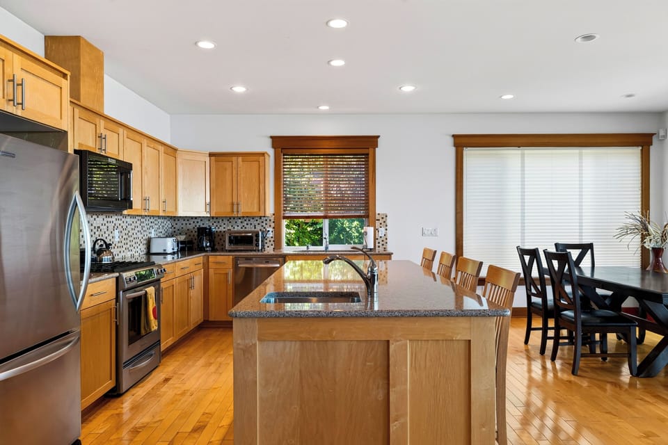 Pull up a seat at the expansive kitchen island, with plenty of room for meal prep, breakfast, and casual conversation.
