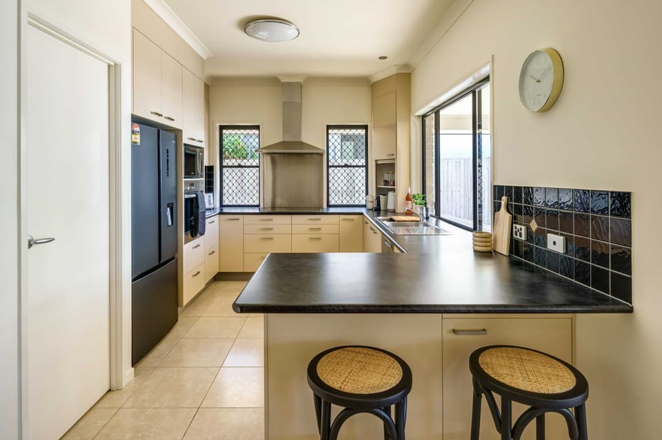 The kitchen is fully-equipped with appliances and utensils.
