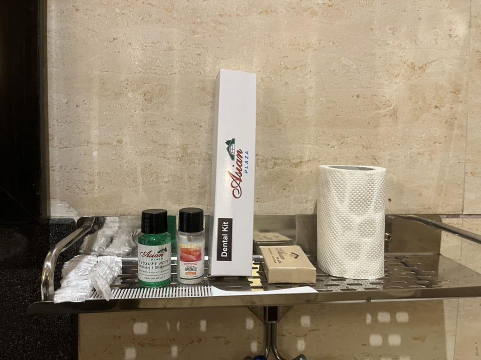 Shower, rainfall showerhead, designer toiletries, slippers
