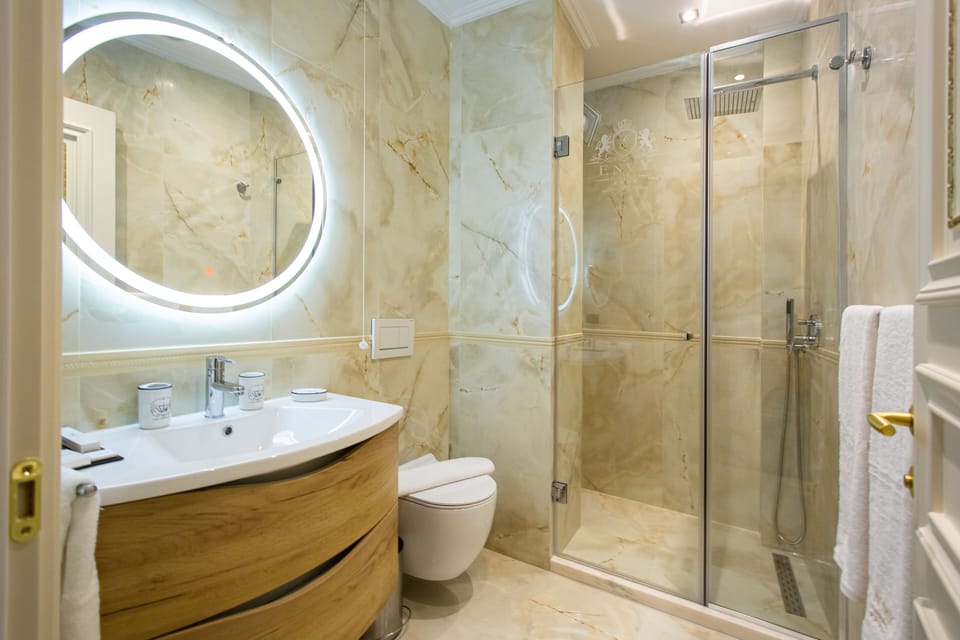Shower, rainfall showerhead, designer toiletries, hair dryer