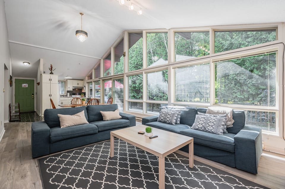 The sitting area is spacious and the large windows provide a truly stunning view. 