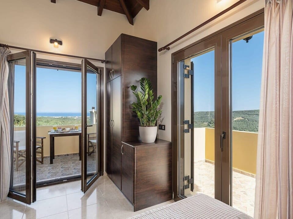 Modern Bedroom with Balcony Views of Both Sea and Mountains