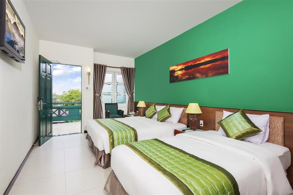 Standard Triple Room | Minibar, in-room safe, desk, soundproofing