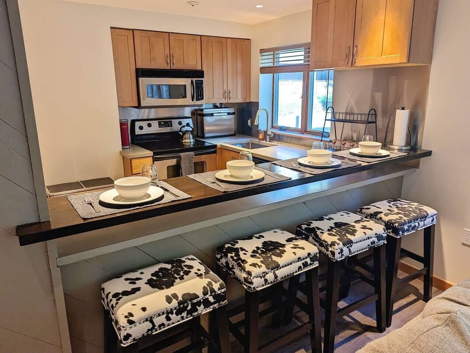 The kitchen bar has seating for four.