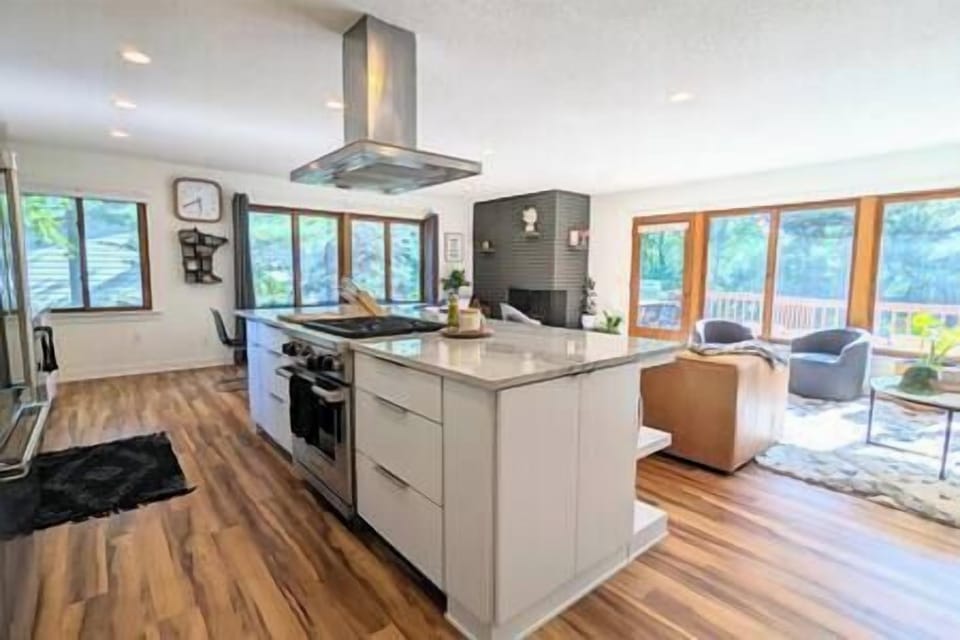 Open concept kitchen, living and dining area overlooking the Mississippi River. 