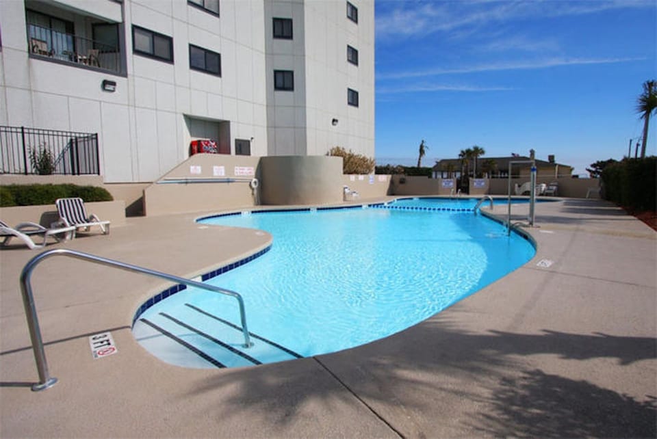 Take a dip in this sparkling pool after a fun day at the beach!