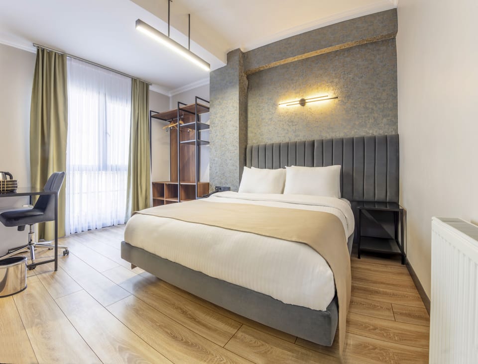 Deluxe Single Room | Premium bedding, minibar, desk, laptop workspace