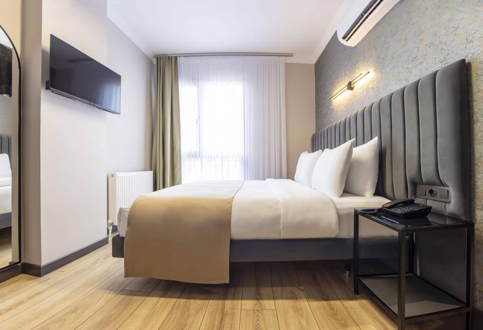 Deluxe Single Room | Premium bedding, minibar, desk, laptop workspace
