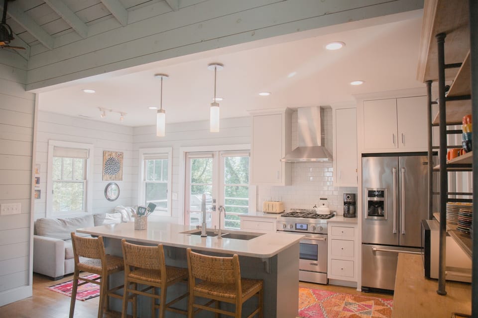 Kitchen with high end JennAir appliances and separate sofa nook