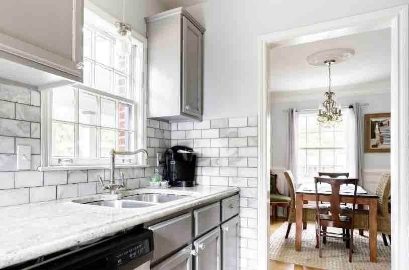 Beautiful marble kitchen looking out to the dining room.