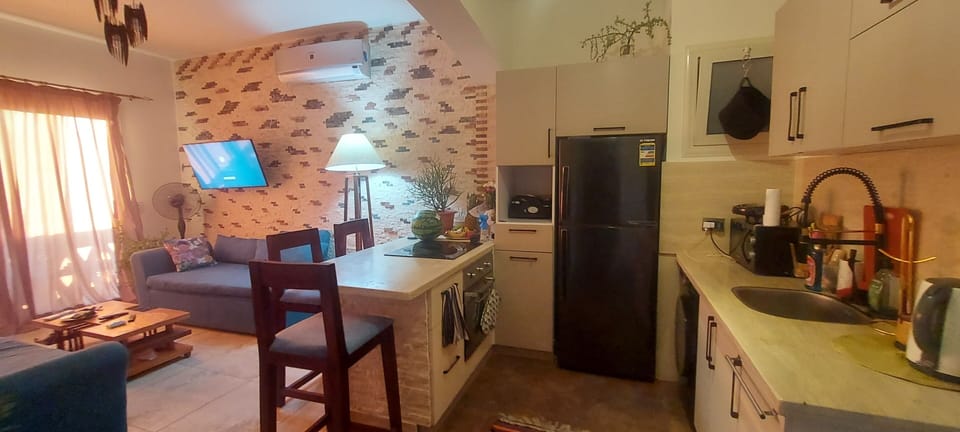 Kitchen with open living room space and balcony 