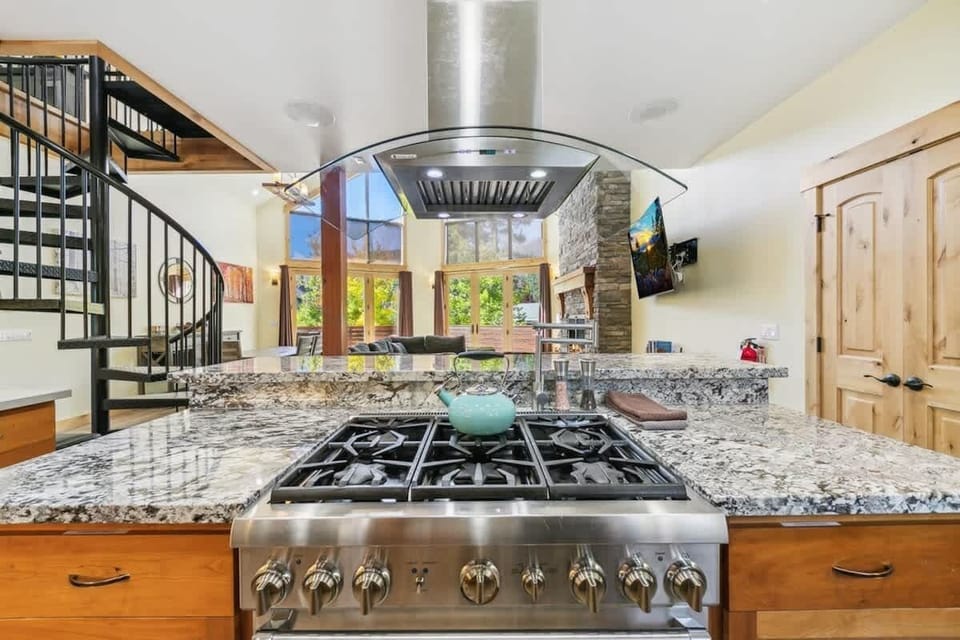 Well-equipped South Lake Tahoe kitchen with gas range, two ovens, large island, cookware, bakeware, dinnerware and utensils—everything needed to prepare family meals and group dinners.