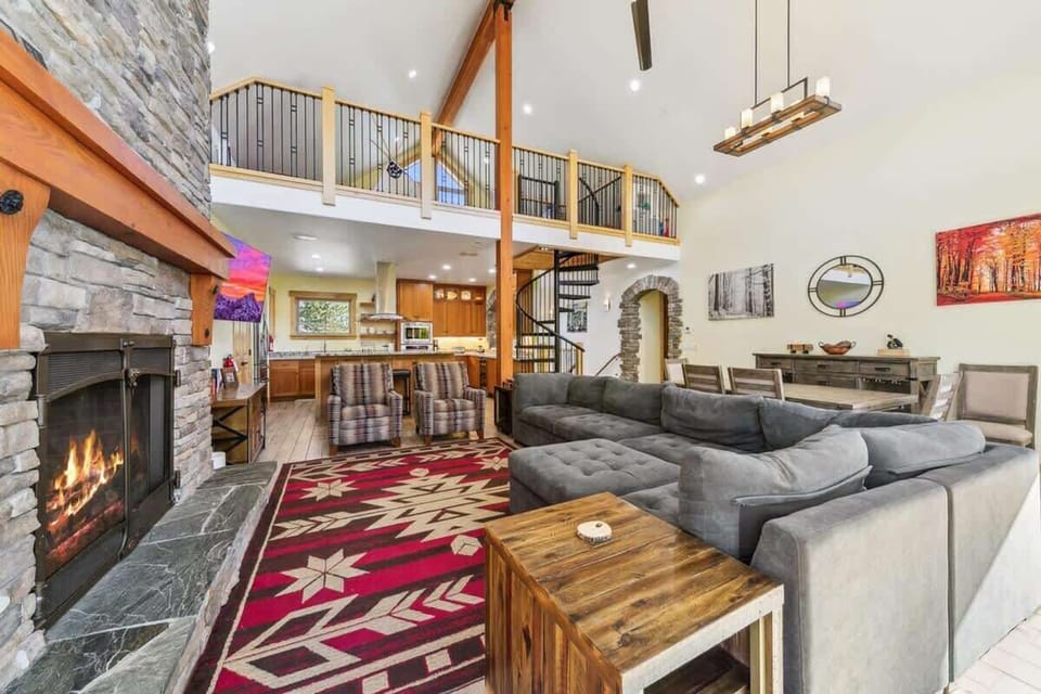 Inviting South Lake Tahoe cabin living space with comfortable furnishings, natural light and mountain-inspired décor, offering another relaxing area for guests to spread out and unwind.