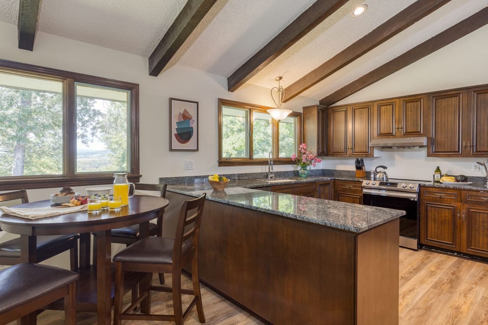 Breakfast nook and fully-equipped kitchen in the main house.