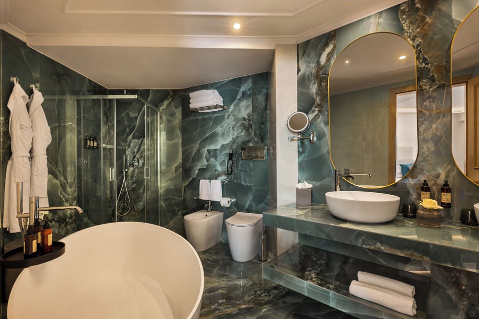 Executive Suite | Bathroom | Designer toiletries, hair dryer, bathrobes, slippers