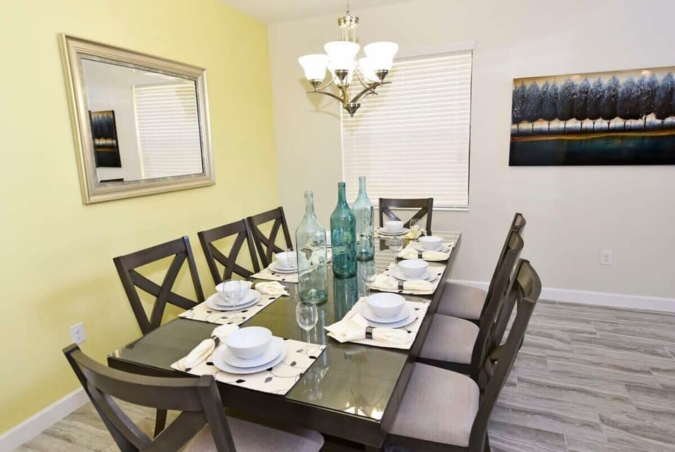 The spacious open-concept dining room has ample seating, making it easy for everyone to enjoy meals together after a day of Florida adventures.