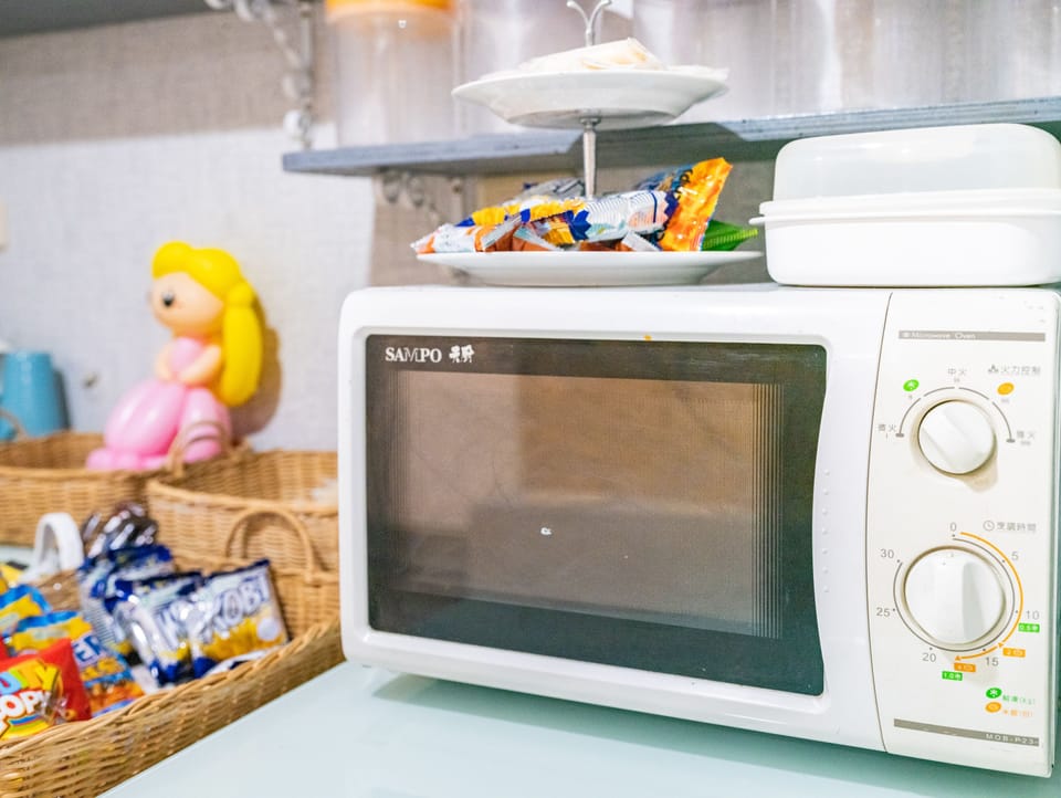 Fridge, microwave, cleaning supplies