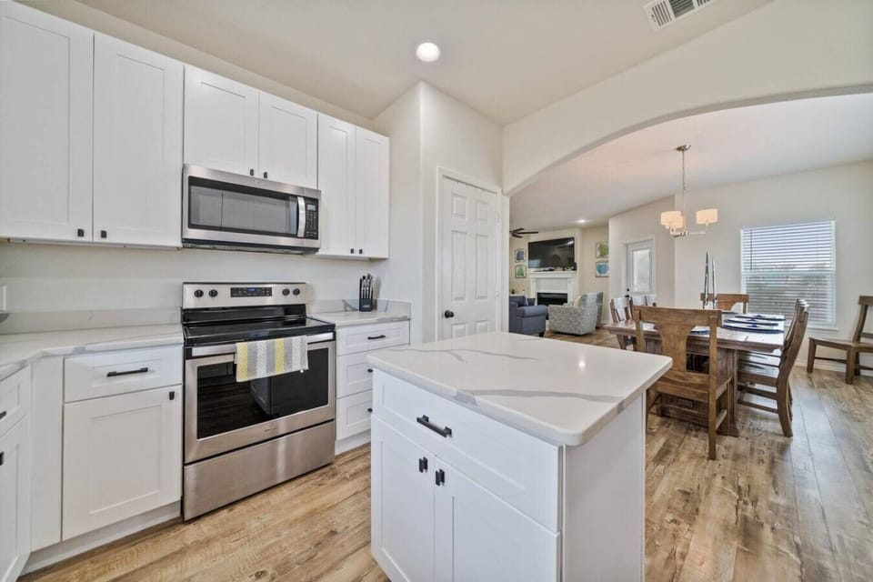 `Fresh White Coastal Kitchen – Fully Equipped for Home-Cooked Beach Meals`