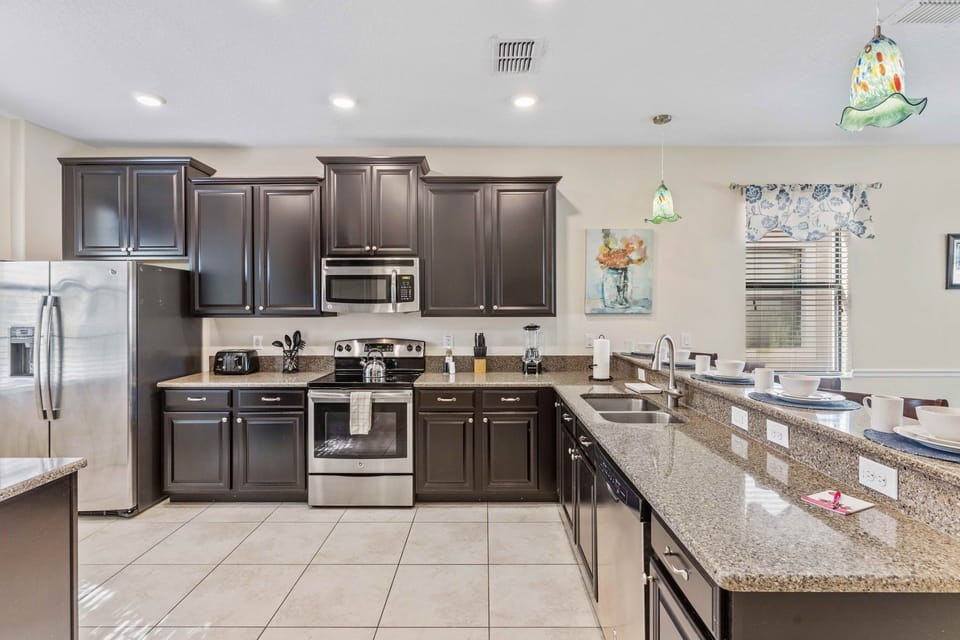 The fully equipped kitchen  is a chef's dream, complete with modern appliances and ample counter space.