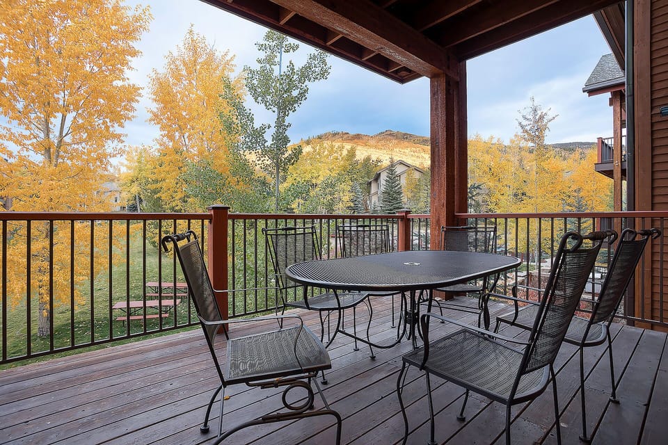 Your private balcony offers stunning autumn views with comfortable seating for morning coffee or evening relaxation.