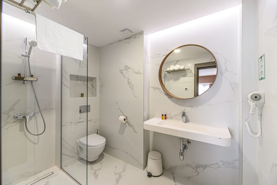 Superior Studio | Bathroom | Hair dryer, towels