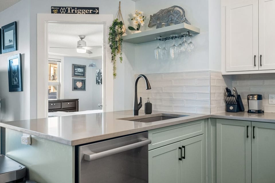 Fully redone kitchen with a drip coffee maker, ground coffee, tea, sugar, and basic condiments (ketchup, mustard, and relish.)
