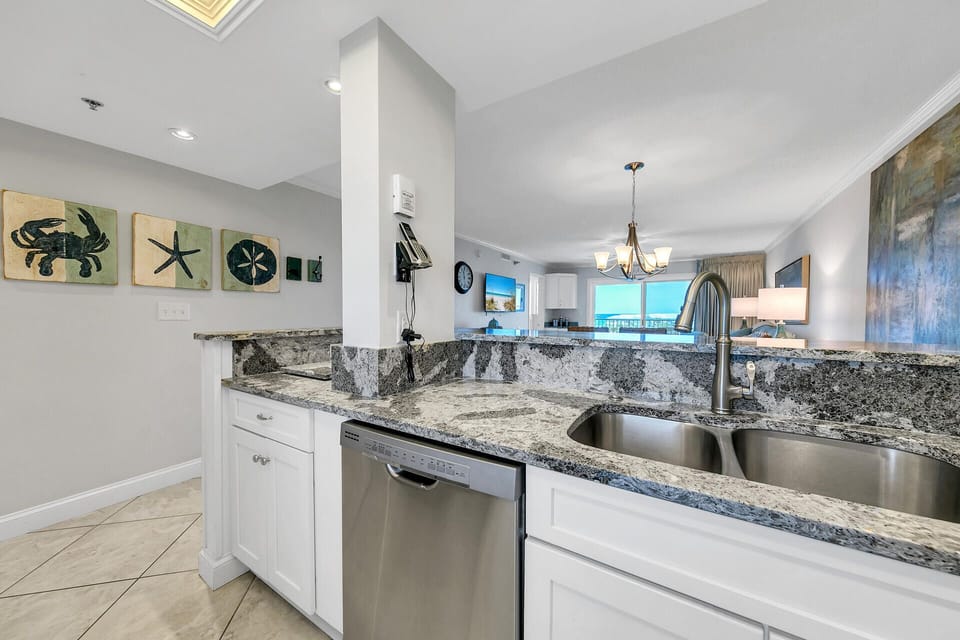 Your gourmet kitchen features elegant granite countertops, stainless steel appliances, and stunning ocean views perfect for preparing memorable meals.