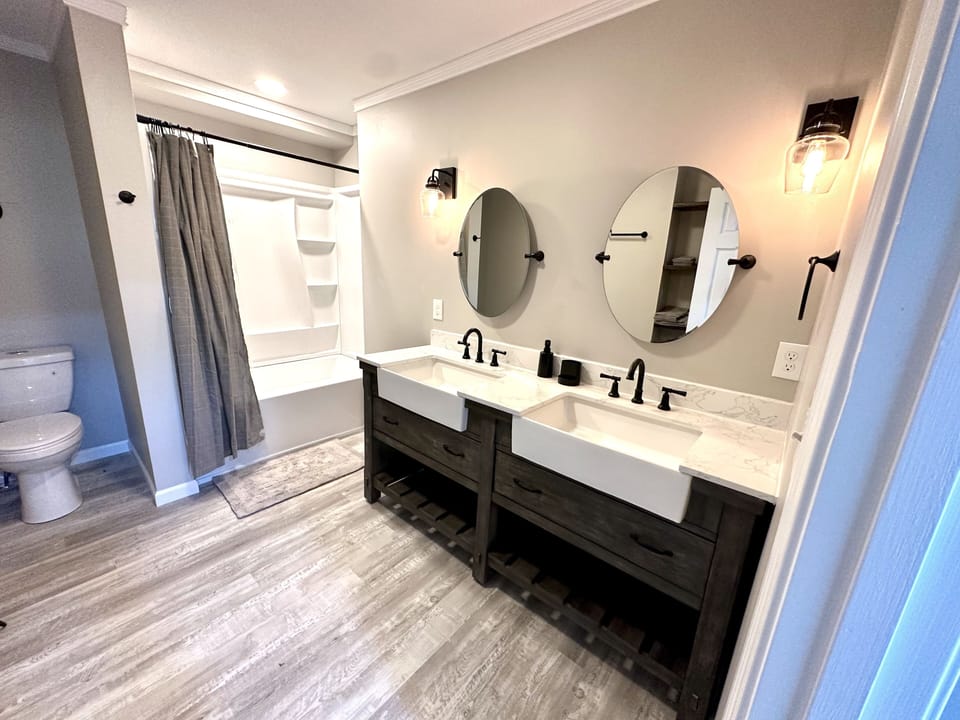 Shared main level bathroom with double vanity