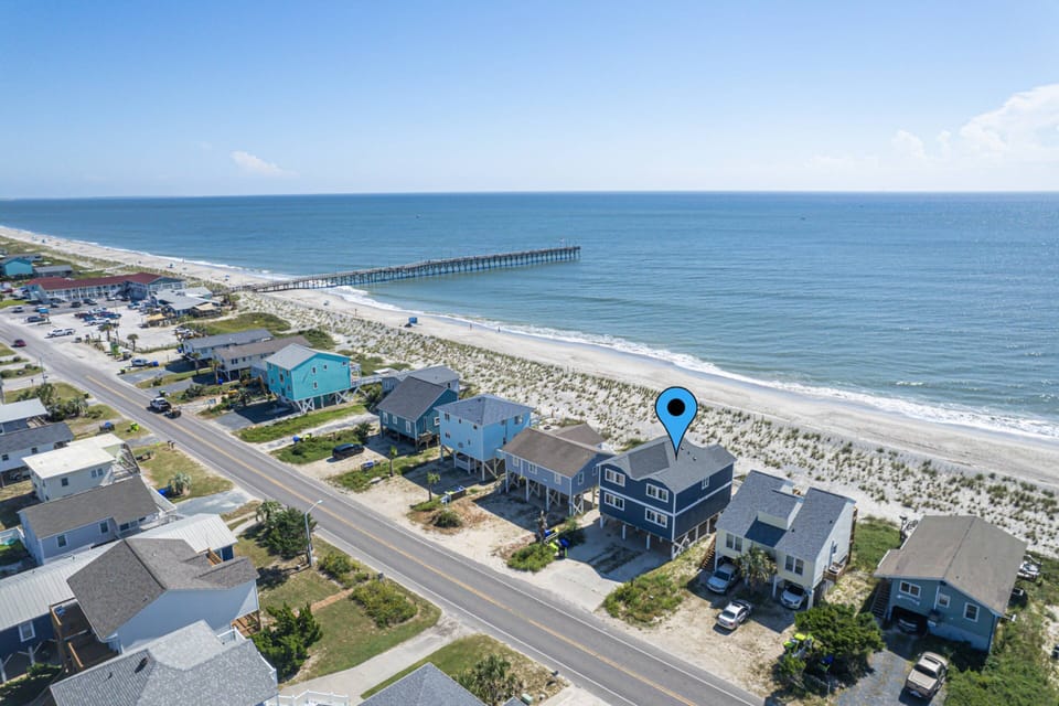 Aerial view facing Southeast with home right on the Beach