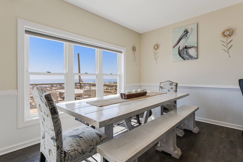 Spacious dining table, offering beautiful beach views to enjoy while dining.