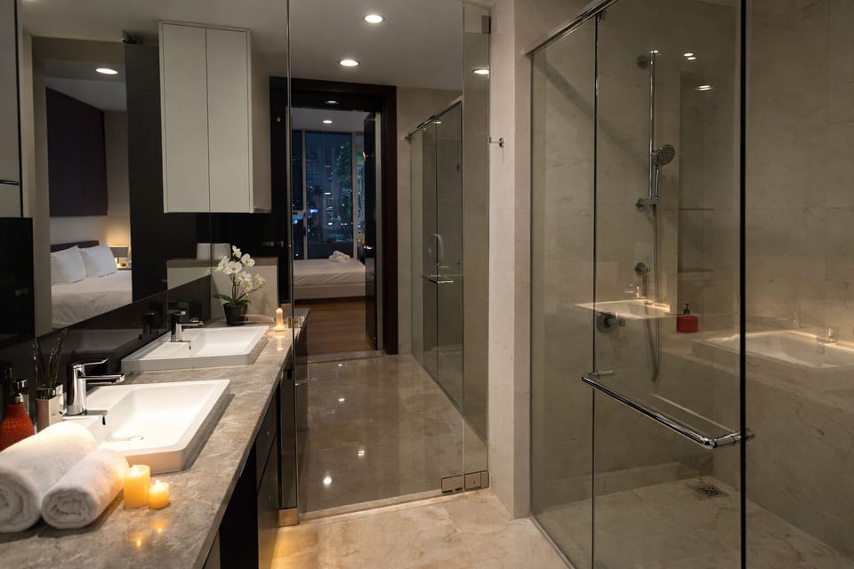 Luxury Apartment, 2 Bedrooms, City View | Bathroom | Separate tub and shower, rainfall showerhead, free toiletries