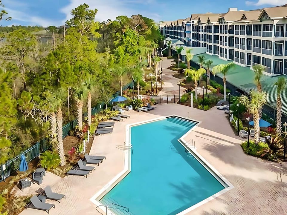 Building features a large outdoor pool