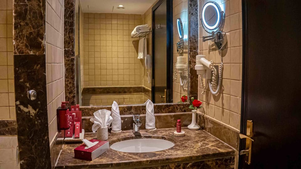 Hair dryer, slippers, bidet, towels
