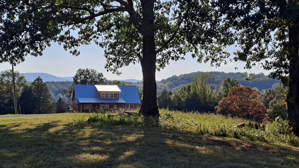 703 Sky Hawk Drive is sited on a prominent point overlooking the river valley.