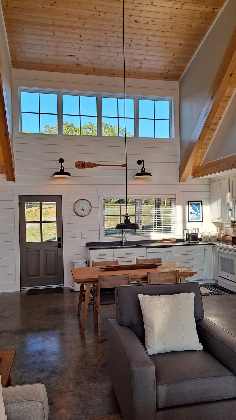 High dormer windows stream natural light into the living area.
