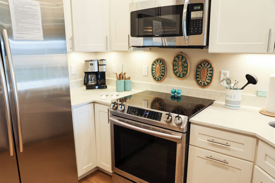 Fully equipped kitchen with quartz countertops and stainless steel appliances