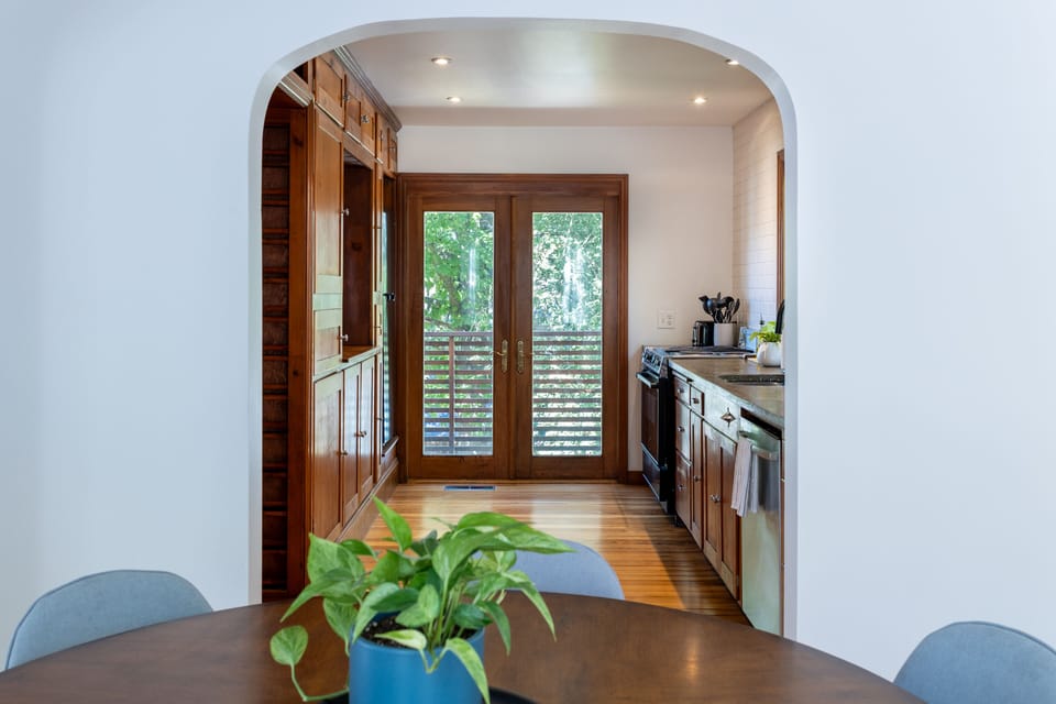 The view from the dining room into the kitchen.