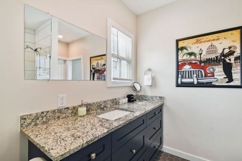 Clean, modern bathroom with updated finishes and essential amenities.