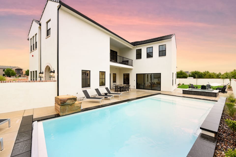 Largest pool in community, hot tub, fire pit, lawn games, fully stocked kitchen.