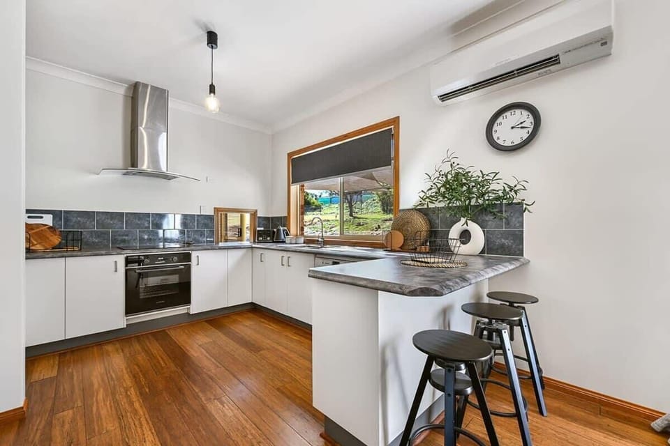Kitchen + Coffee Machine + Breakfast Bar with Stools